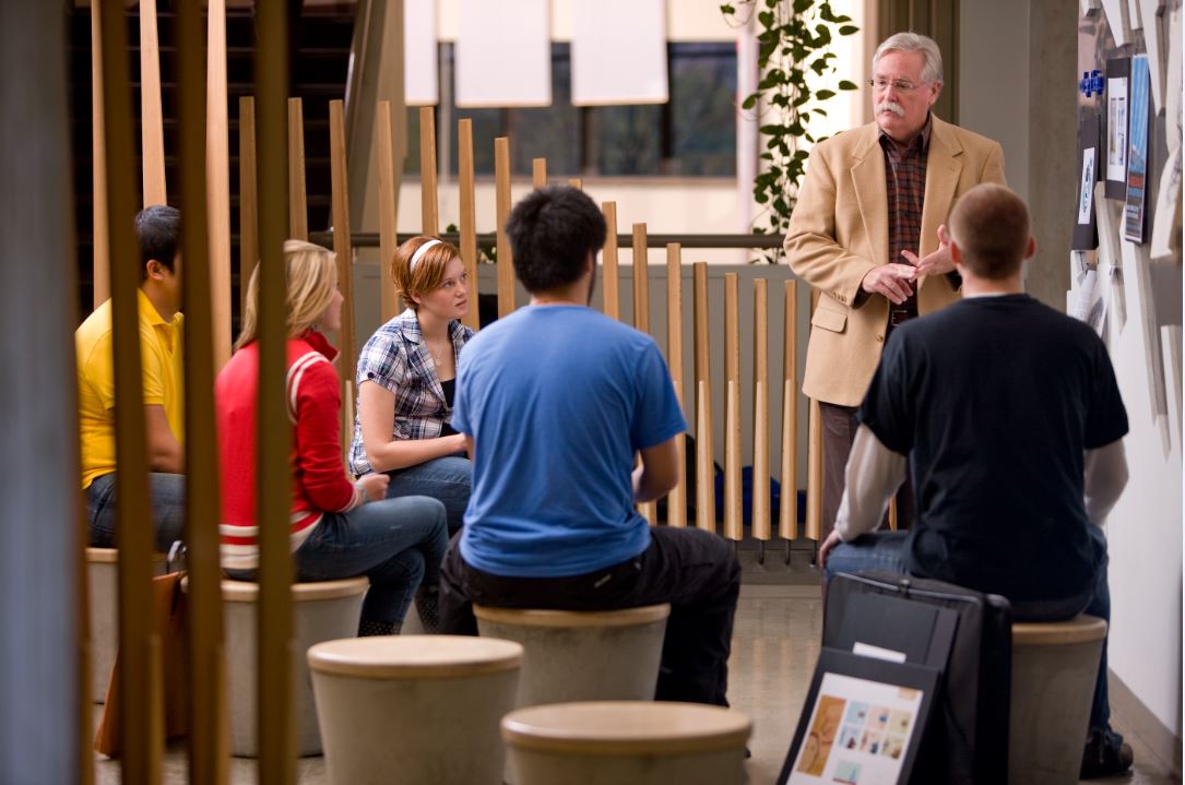 Teacher talking to students